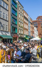 London, UK - 18 April 2021: Outdoor Drinking And Dining Outside Pubs On Old Compton Street, Soho, Central London