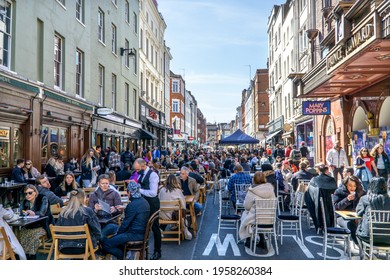 London, UK - 18 April 2021: Lockdown Easing, Outdoor Drinking And Dining Outside Pubs On Old Compton Street, Soho, Central London