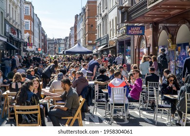 London, UK - 18 April 2021: Outdoor Drinking And Dining Outside Pubs On Old Compton Street, Soho, Central London