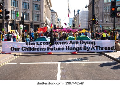 London, UK, 19th April 2019. Climate Change Eco Protesters At The Extinction Rebellion Demonstration, At Oxford Circus, London, In Protest Of World Climate Breakdown And Ecological Collapse.