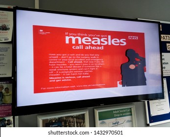 London, UK - 20 June, 2018: A Sign Warning People About Measles In A NHS Doctors Surgery Clinic.