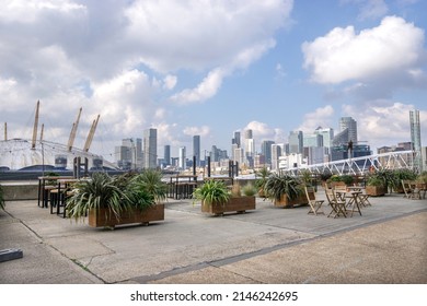 London, UK - 20 March 2022: Trinity Buoy Wharf Beer Garden Overlooking The River Thames, Poplar, Docklands, London