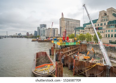 London, UK - 2019: Construction Near Vauxhall Bridge, Cranes, Workers, Thames River.