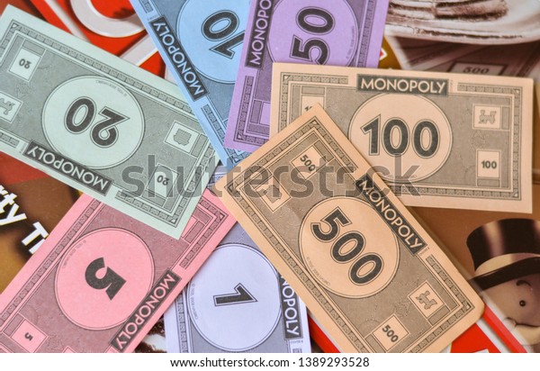 London,\
UK, 2020. Fake paper money / currency notes in monopoly board game.\
Playing at home in quarantine during lockdown\
