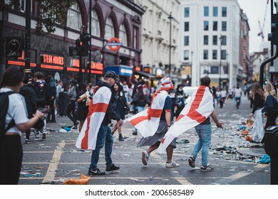 London | UK - 2021.07.12: Euro 2020 Football Fans Walking Down The Road Wearing English Flags As A Capes