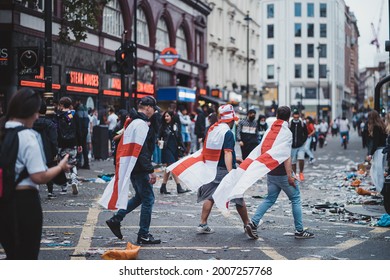 London | UK - 2021.07.12: Euro 2020 Football Fans Walking Down The Road Wearing English Flags As A Capes