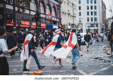 London | UK - 2021.07.12: Euro 2020 Football Fans Walking Down The Road Wearing English Flags As A Capes