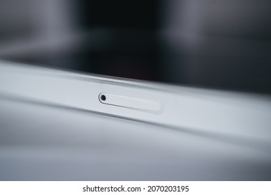 London | UK - 2021.10.09: Close Up Product Photos Of Sim Card Slot Of Iphone SE In Silver Color Sealed In Plastic On Box