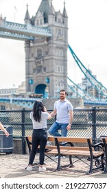 London, UK - 21 June, 2022: People Making Photos On The Thames River Walk At Summer Sunny Day.  Street Photography