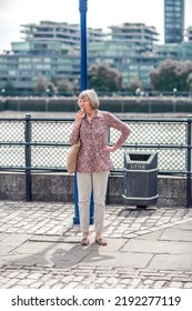 London, UK - 21 June, 2022: Woman On The Thames River Walk At Summer Sunny Day.  Street Photography