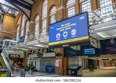 London, UK - 22 November 2020: NHS Digital Screen With Hands Face Space Message During Covid19 At Liverpool Street Station - Train And Underground Tube Station With Large Concourse And Shops