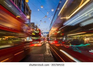 LONDON, UK - 23RD DECEMBER 2015: Busy Traffic Down Oxford Circus In London During The Christmas Season. Double Decker Buses Can Be Seen.