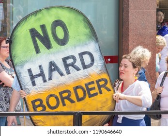 London, UK; 23rd June 2018; Pro-EU Protester On The Peoples Vote March Holds A Large Homemade Sign About The Brexit Irish Border Issue 