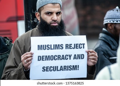 London, UK - 24 January 2014: A Protester Holds A Placard Reading 