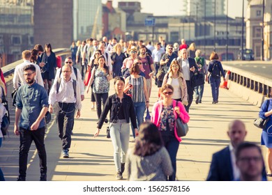 London, UK - 26 June, 2018: Business People And Office Workers Crossing The London Bridge On The Way To Work.  City Of London Busy Business Life.