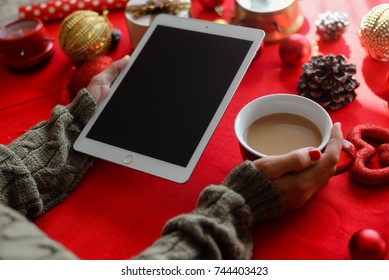 London, UK - 28 October 2017: Closeup On Person Hands Using Apple Ipad 2 Smart Tablet At Christmas Festive Table Background. Communication Technology Mockup Abstract Background. Joyful Happy Fun Time