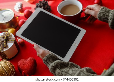 London, UK - 28 October 2017: Closeup On Person Hands Using Apple Ipad 2 Smart Tablet At Christmas Festive Table Background. Communication Technology Mockup Abstract Background. Joyful Happy Fun Time