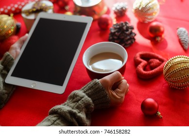 London, UK - 28 October 2017: Closeup On Person Hands Using Apple Ipad 2 Smart Tablet At Christmas Festive Table Background. Communication Technology Mockup Abstract Background. Joyful Happy Fun Time