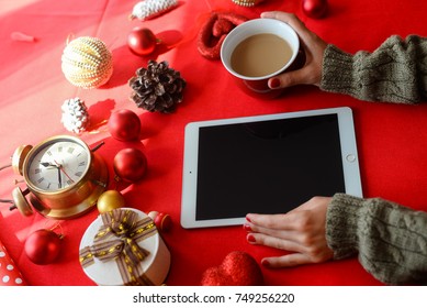 London, UK - 28 October 2017: Closeup On Person Hands Using Apple Ipad 2 Smart Tablet At Christmas Festive Table Background. Communication Technology Mockup Abstract Background. Joyful Happy Fun Time