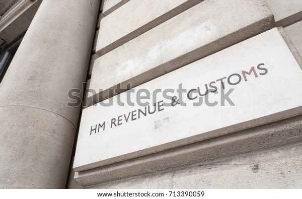LONDON, UK - 29 AUGUST 2017: HM Revenue and\
Customs. A sign outside the UK government building for the HMRC tax\
office on London\'s Whitehall,\
England.