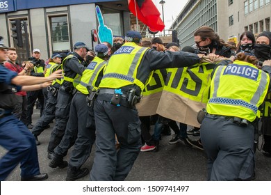 London, UK. 3rd August 2019. Anti-Fascist campaigners clash with police at the "Oppose Tommy Robinson" counter demonstration, in protest of a march being held by far-right supporters of Mr Robinson.