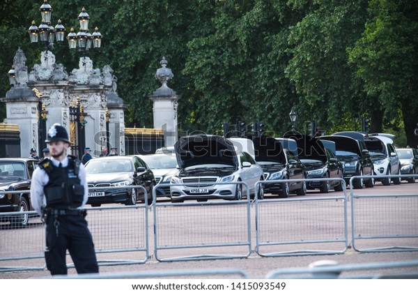 London, UK.\
3rd June, 2019. Cars are security checked as they arrive for the\
State Banquet at Buckingham Palace. President Trump\'s three-day\
state visit  include lunch with the Queen,\
