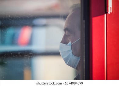 London, UK - 4 November, 2020 - A Senior Man With A Face Mask On A Double-decker Bus