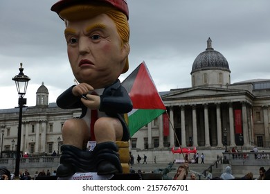 London, UK. 4th June 2019. Giant model of Donald Trump on Trafalgar Square, sitting on a golden toilet while tweeting, during anti-Trump protests in central London.