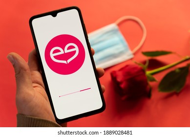 London, UK - 6 January 2021: Close Up Of Meetic Dating App Logo On Mobile Phone With Red Rose And Covid Face Mask. Concept Of Online Dating During Coronavirus Pandemic