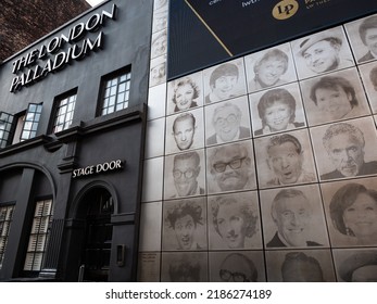 London, UK – 7 28 2022: The ‘Wall of Fame’ beside the Stage Door of The London Palladium theatre shows the faces of famous entertainers who have performed there. 
