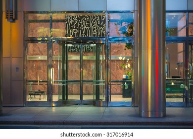 LONDON, UK - 7 SEPTEMBER, 2015: Office Building Entrance In Night Light. Canary Wharf Night Life