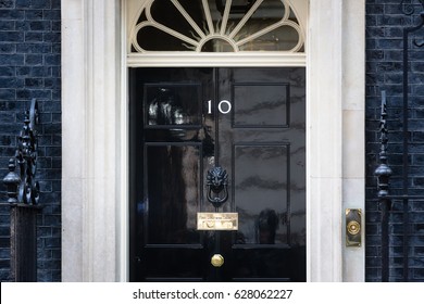 LONDON, UK - Apr 19, 2017: Entrance door of 10 Downing Street in London official residence of First Lord of the Treasury, headquarters of Her Majesty's Government and office of Prime Minister