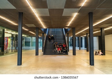 LONDON, UK - APRIL 1, 2019: People In Interior Of Tate Modern Turbine Hall In London