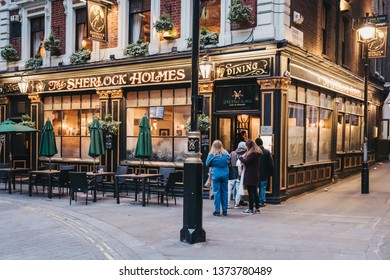 London, UK - April 13, 2019: People Entering Sherlock Holmes Pub In London, A Traditional English Pub With Holmes-themed Memorabilia, Restaurant And Roof Garden.