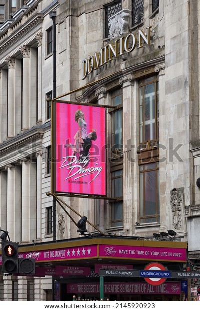 LONDON, UK - APRIL 13, 2022:  Exterior view of\
Dominion Theatre on Tottenham Court Road with poster sign for Dirty\
Dancing Musical