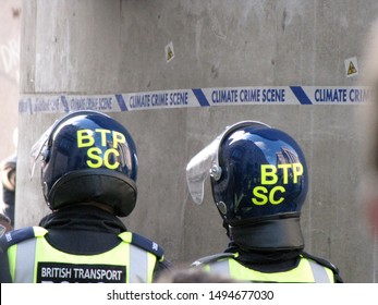 London / UK - April 1st 2009: Riot Police Stand In Front Of A Statue With 