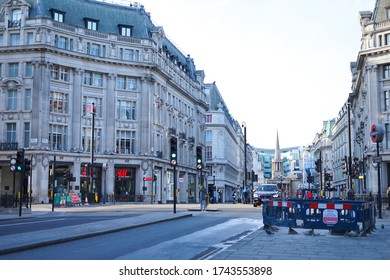 London, UK - April 2020: Famous Oxford Circus Empty And Shops Closed Due To The Covid-19 Lockdown