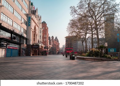 London, UK - April 2020: Leicester Square During Coronavirus Lockdown. Empty With No People. Stay Home NHS Sign. Iconic London Landmark With Famous Billboard 