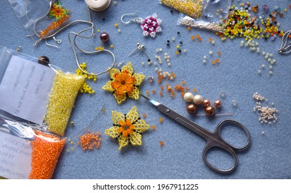 London UK, April 2021: Beaded Flowers On Jewellery Maker Table.