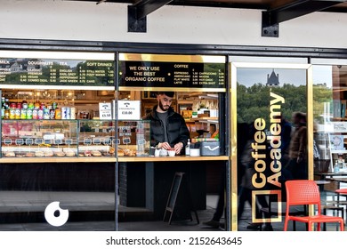 London, UK, April 2022, An independant coffee and pastry shop with the barrister at the window on the south bank of River Thames
