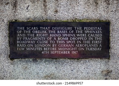 London, UK - April 20th 2022: Plaque at Cleopatras Needle in London, UK, describing how the scars on the base of the obelisk were caused by an air raid during the First World War.