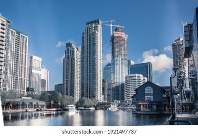 London, UK - April 26, 2019: New Residential Development At Canary Wharf, Building Site With Cranes, View From Docks