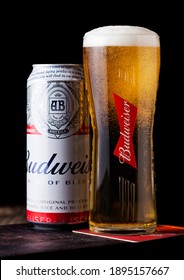 LONDON, UK - APRIL 27, 2018: Aluminium Can Of Budweiser Beer On Wooden Background With Label, An American Lager First Introduced In 1876.