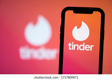 LONDON, UK - April 29 2020: Tinder online dating app logo on a smartphone
