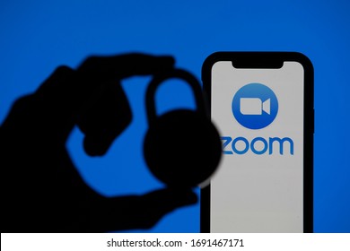 LONDON, UK - April 2nd 2020: Zoom Video Conference App Icon On A Mobile Device With Silhouette Of A Padlock