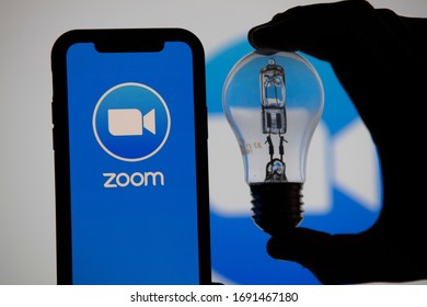 LONDON, UK - April 2nd 2020: Zoom Video Conference App Icon On A Mobile Device With Silhouette Of A Lighbulb