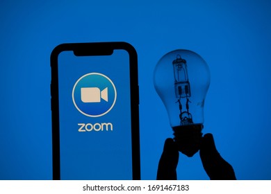 LONDON, UK - April 2nd 2020: Zoom Video Conference App Icon On A Mobile Device With Silhouette Of A Lighbulb