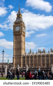 London, UK, April 6, 2012 : Big Ben of the Houses of Parliament with tourists which is a popular tourism travel destination visitor landmark of the city, stock photo image