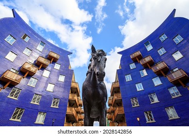 London, UK - Aug 11 2021: Statue of Jacob, the Circle dray horse located at The Circle, Queen Elizabeth Street, Shad Thames, London. The statue commemorates the horses used for deliveries in London.