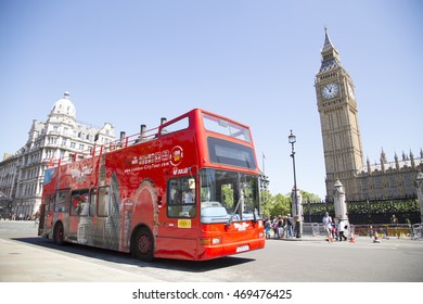 LONDON, UK - AUG 12, 2016: Open Top Site Seeing City Tour Bus Passes Big Ben